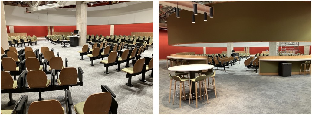 Lecture Theatre with rows of seats in a circle facing a lectern in the centre. A ring shaped screen is above the seating.